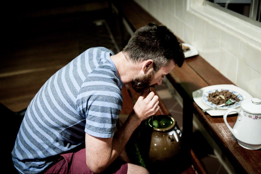 a guest drinking traditional rice wine